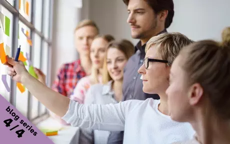 team looking at sticky notes